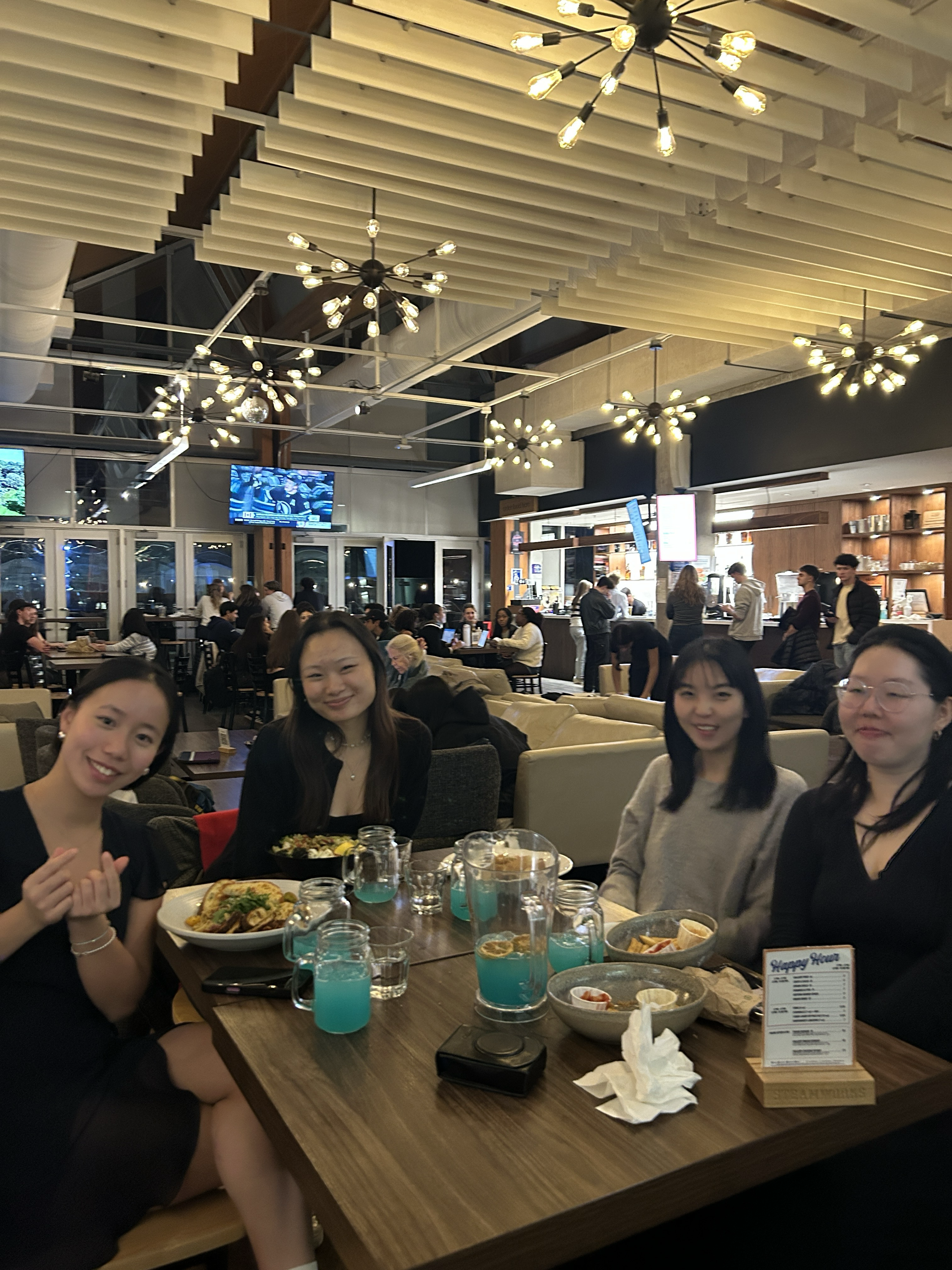 The nwDesign team — four designers together at a team dinner